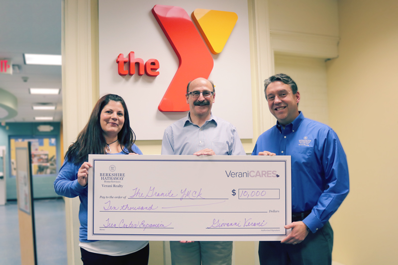 presenting donation to YMCA